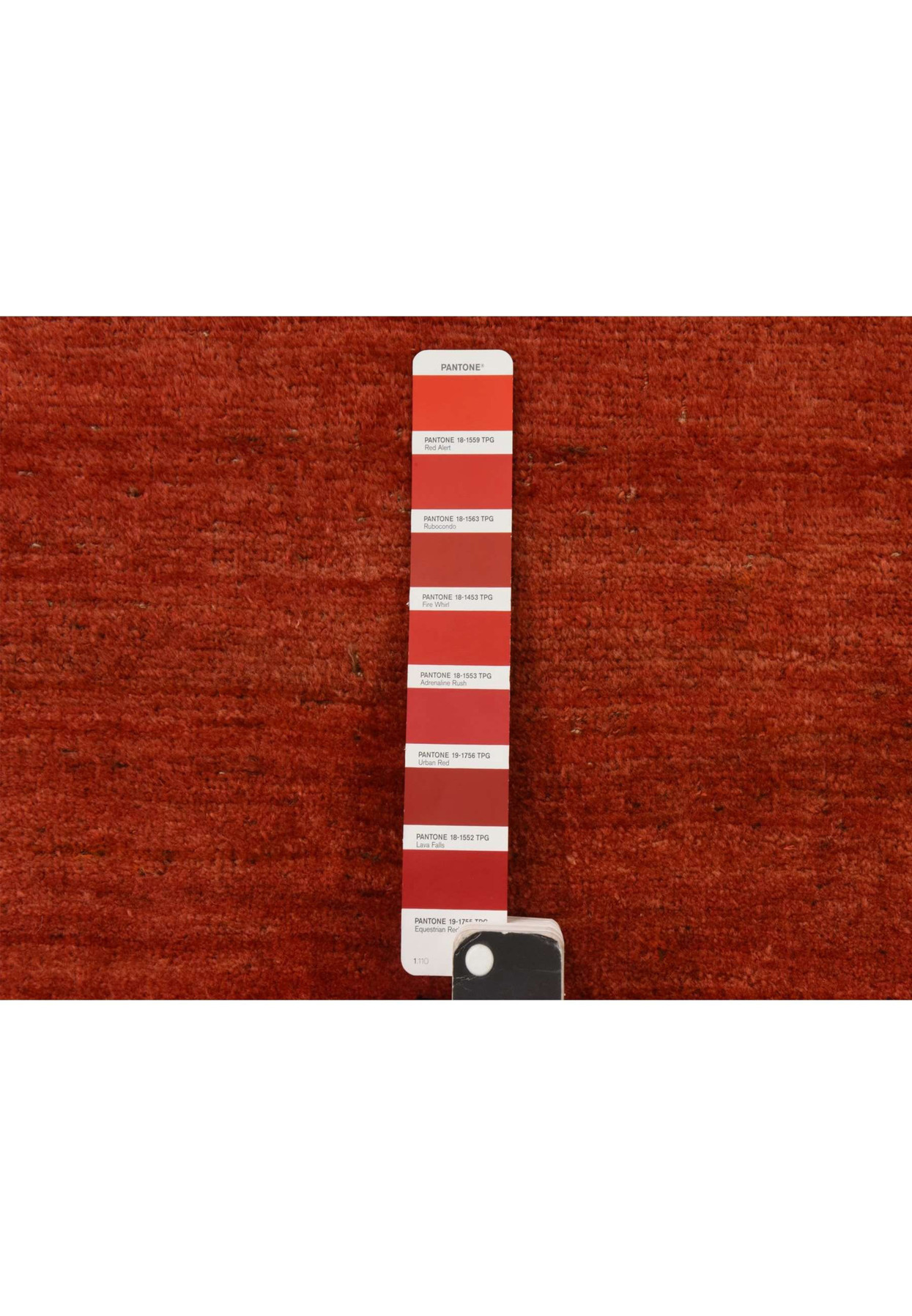Copper-red field of the antique Bijar shown beside a color strip, lustrous hand-knotted wool