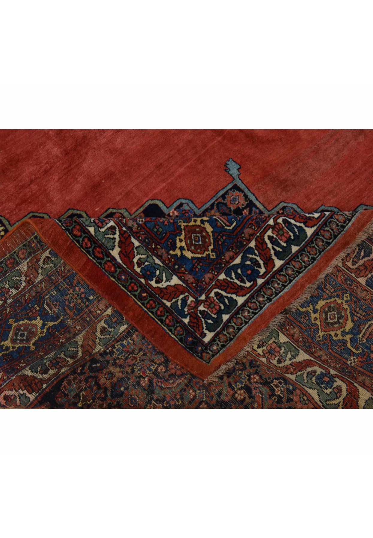 Folded corner of the Bijar revealing the wool foundation and its professionally secured selvage