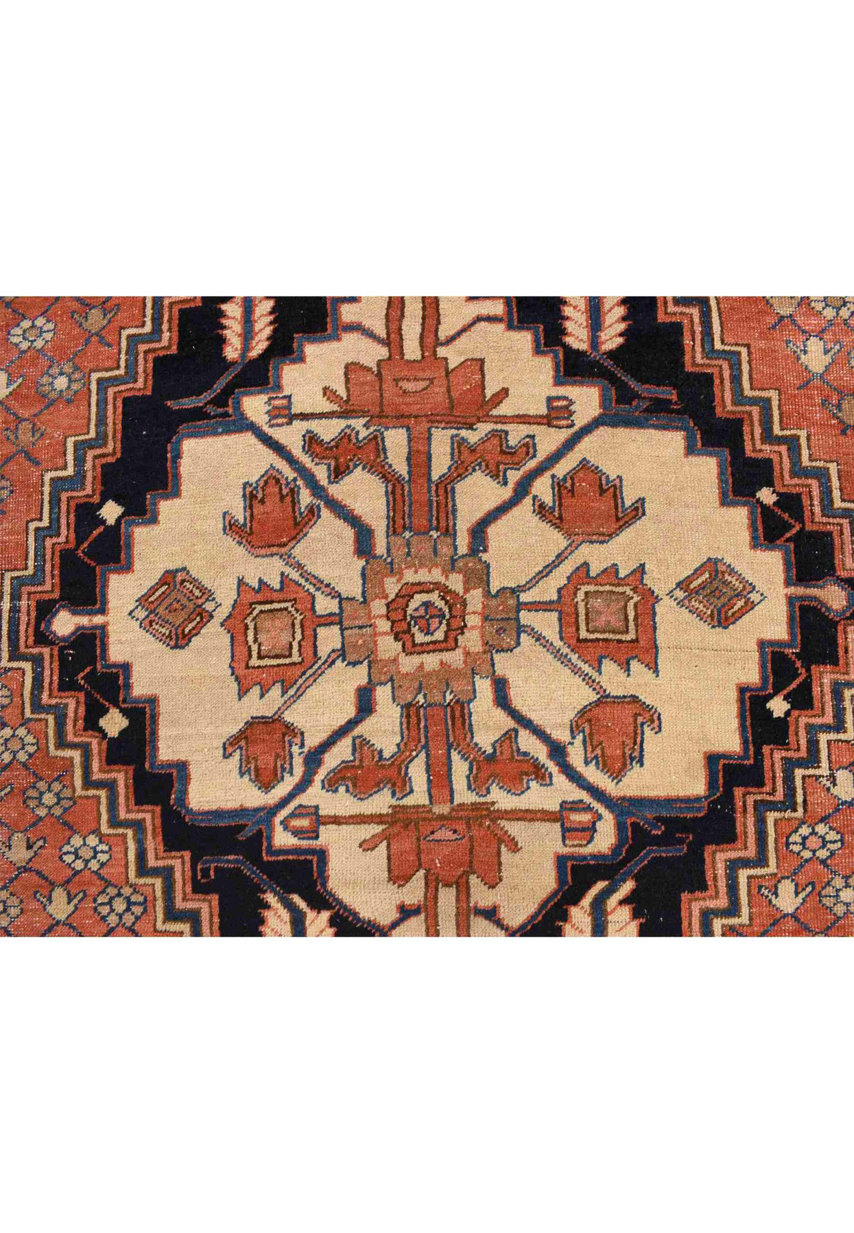 Geometric ivory and midnight blue medallion detail with tribal drawing on antique Persian weaving