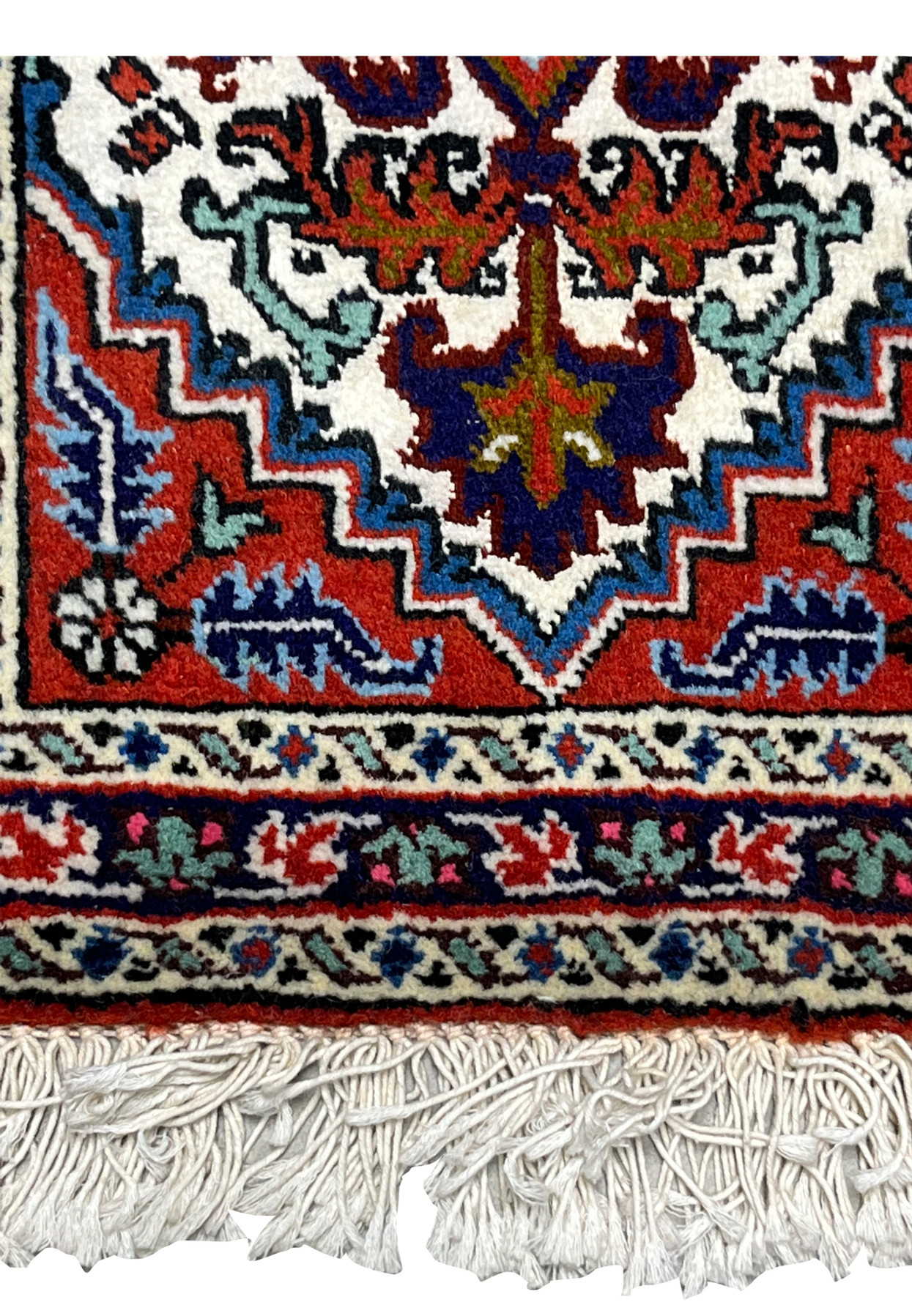 Lower field and border detail showing stepped spandrels on miniature wool and silk Ardebil