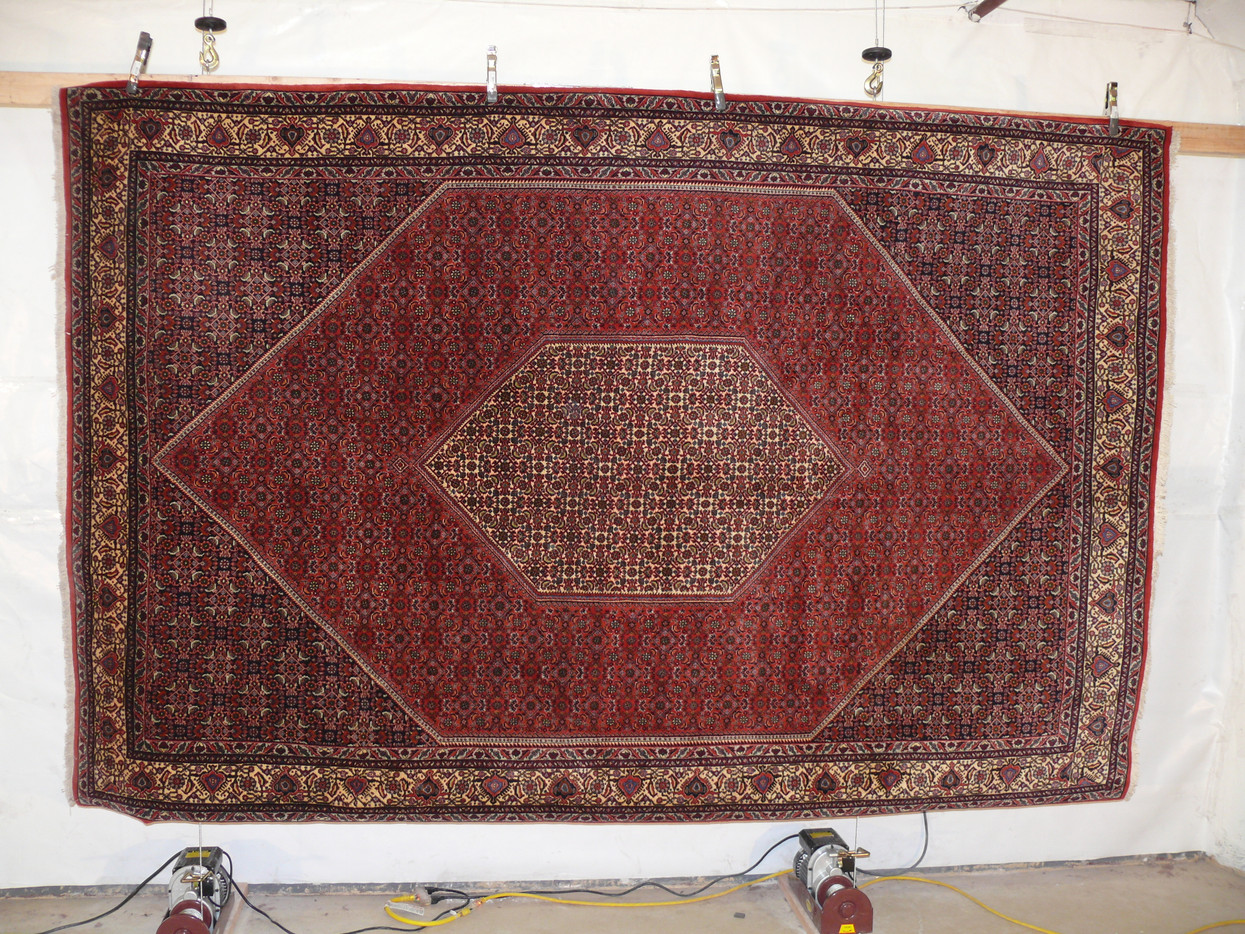 Famously dense hand knotted Bijar hanging for inspection, nearly indestructible Kurdish weaving