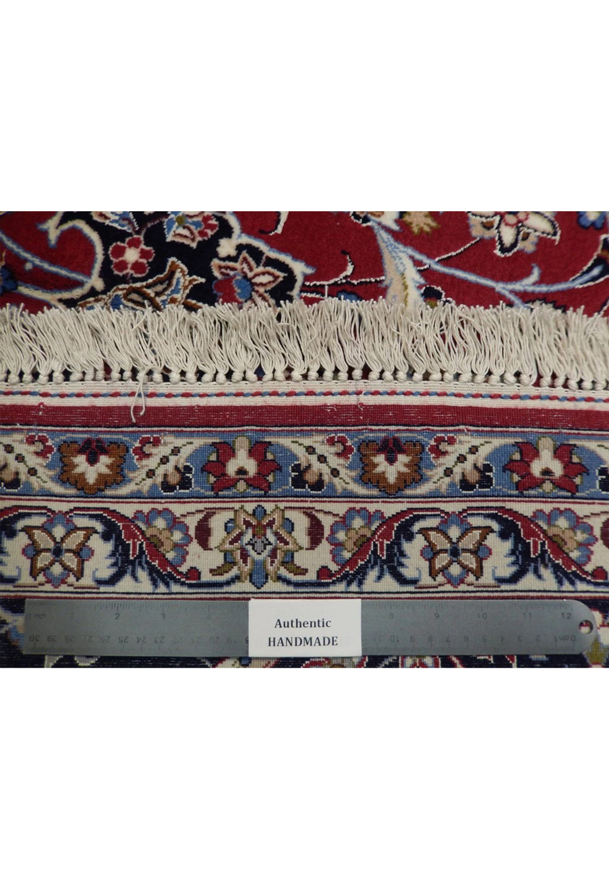 Backside of signed Isfahan showing dense 500 knot per inch weave on silk foundation