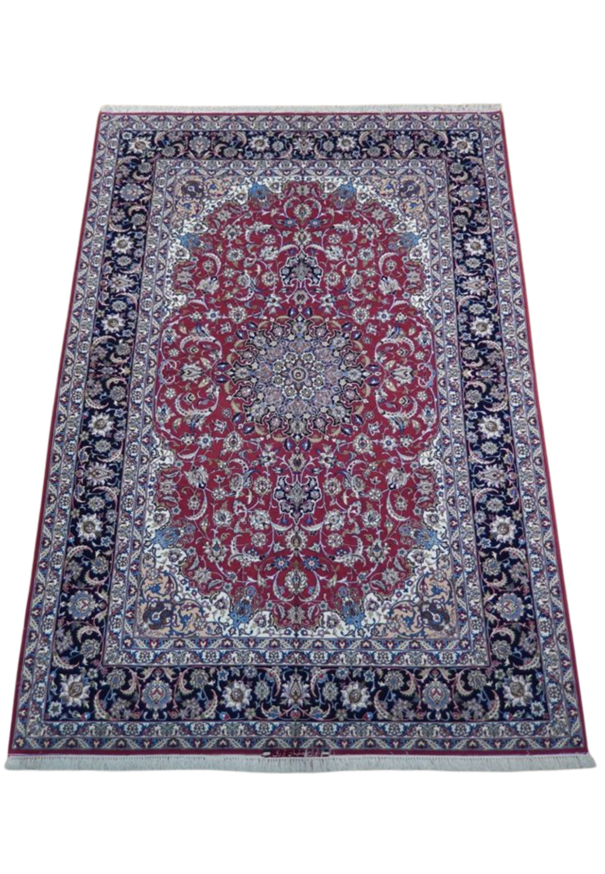 Top view of wool and silk Isfahan showing navy palmette border and ivory corner reserves