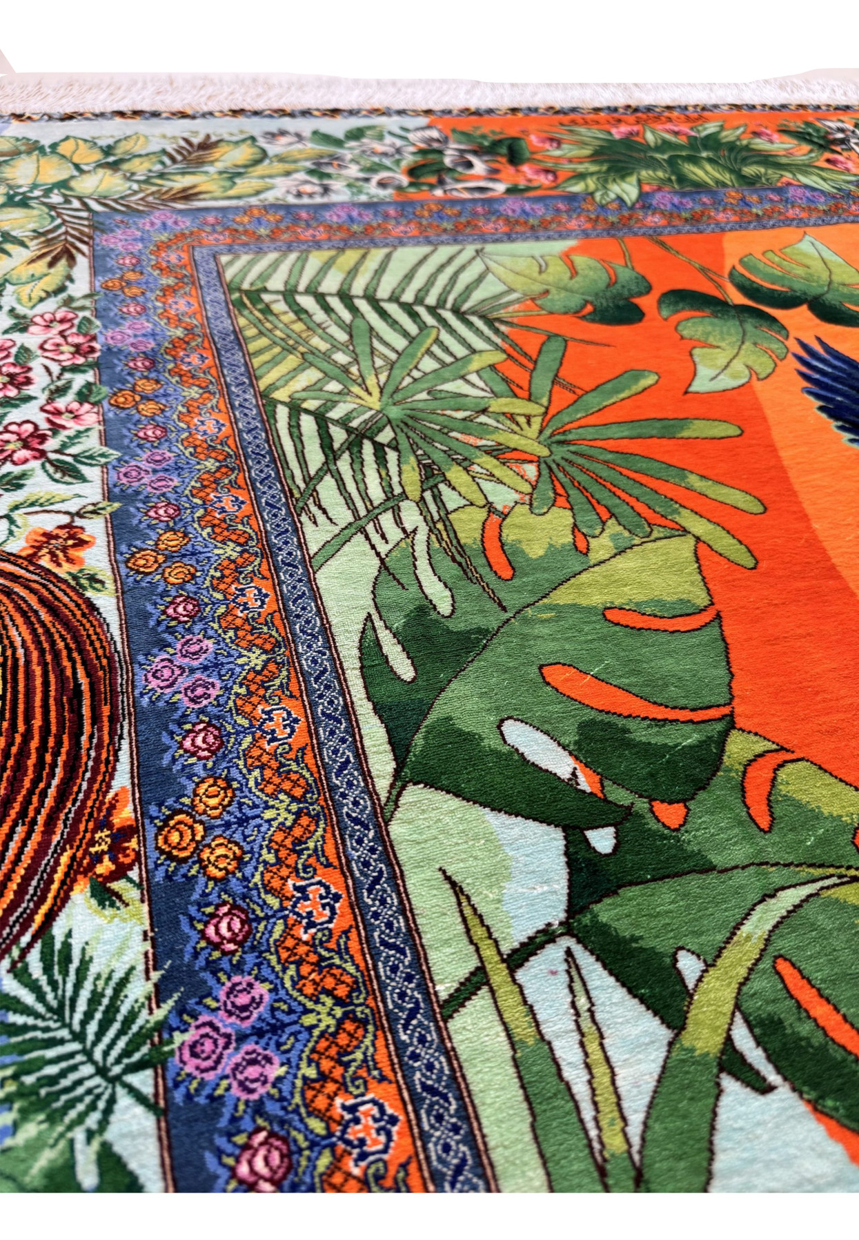 Transition from floral guard stripe to bird of paradise outer border in vivid silk