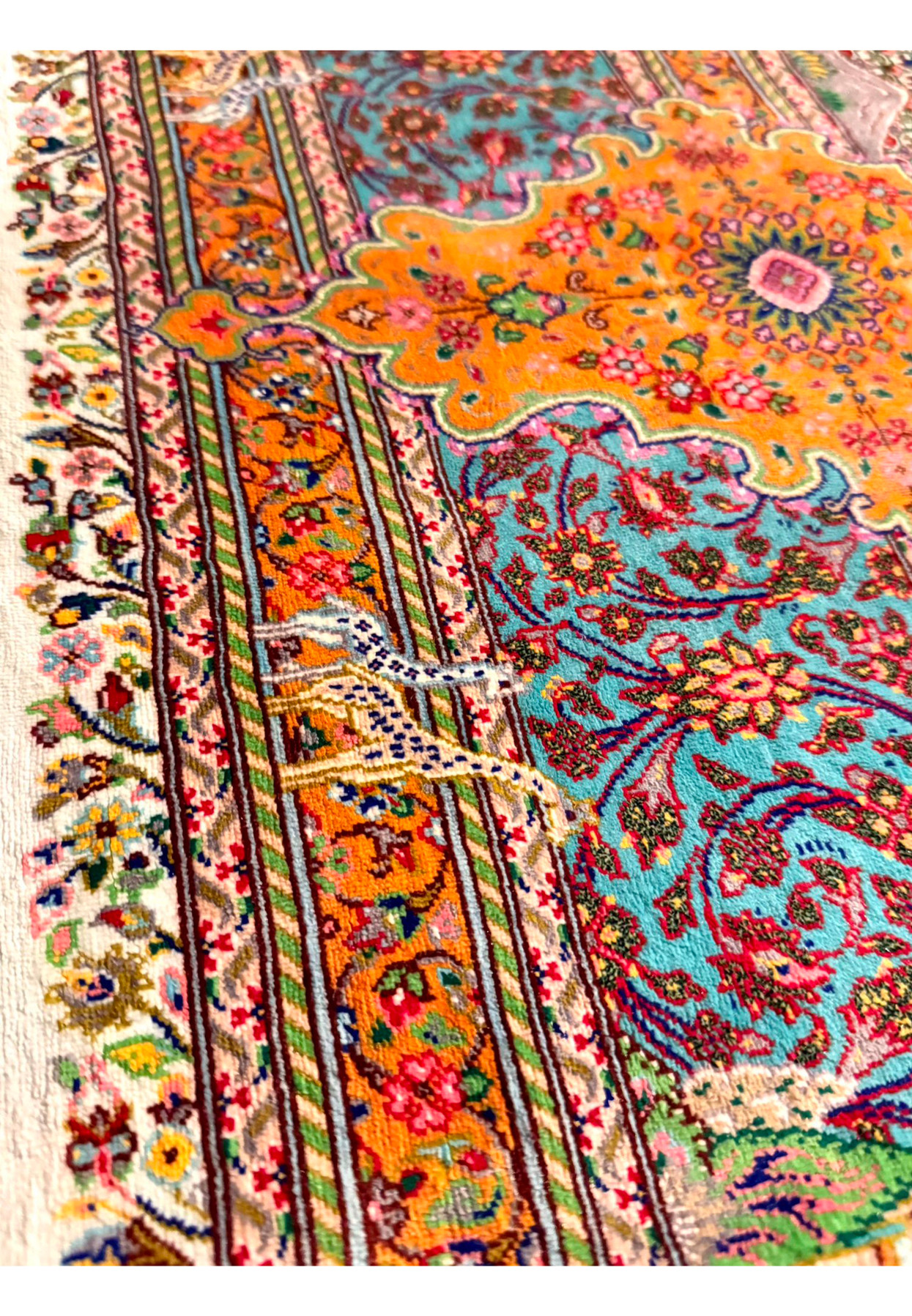 Knotted giraffes strolling the orange landscape band among mountains and flowers