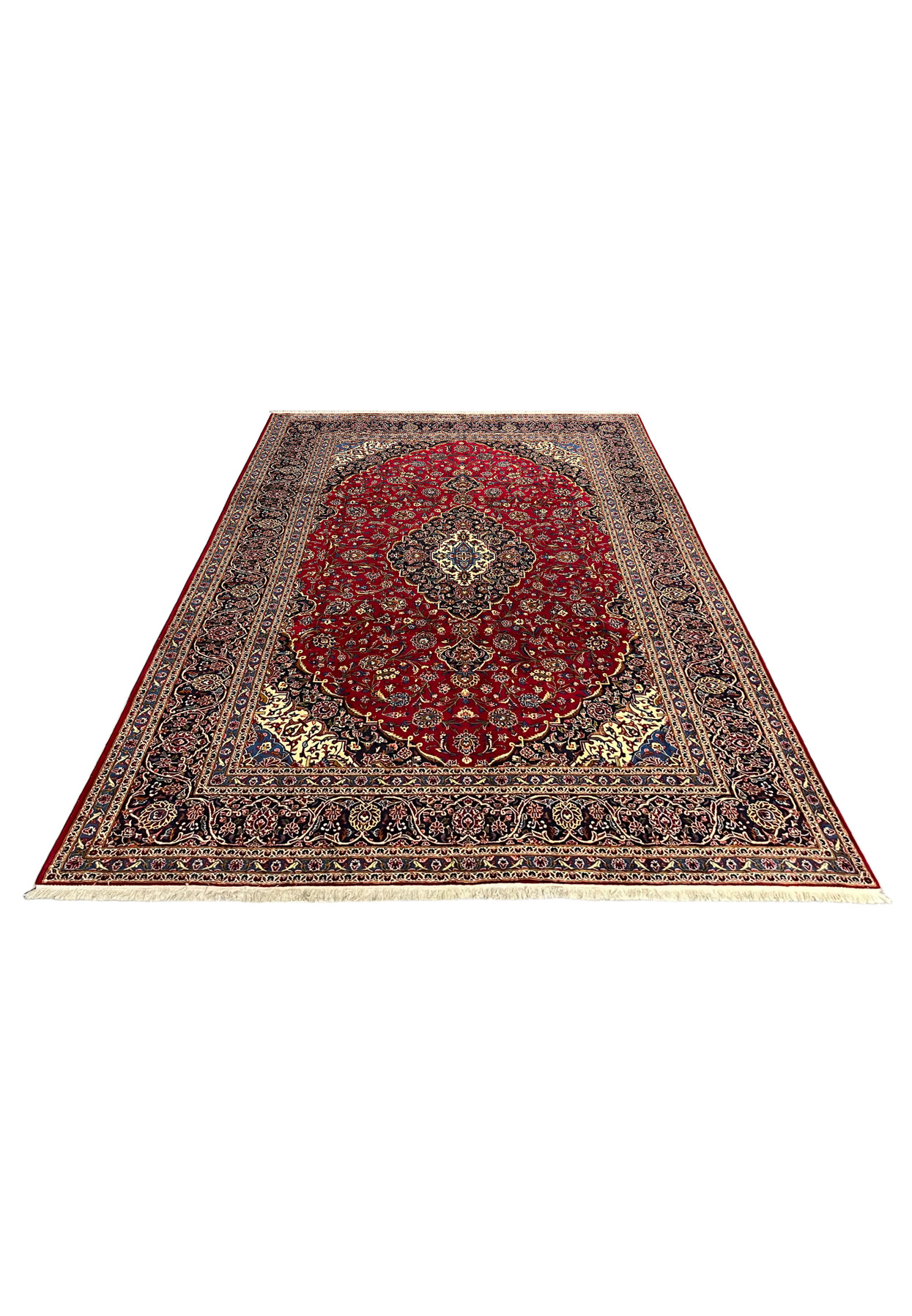 10'1x13'3 Persian Kashan rug laid flat, deep red field with navy medallion and ivory corners