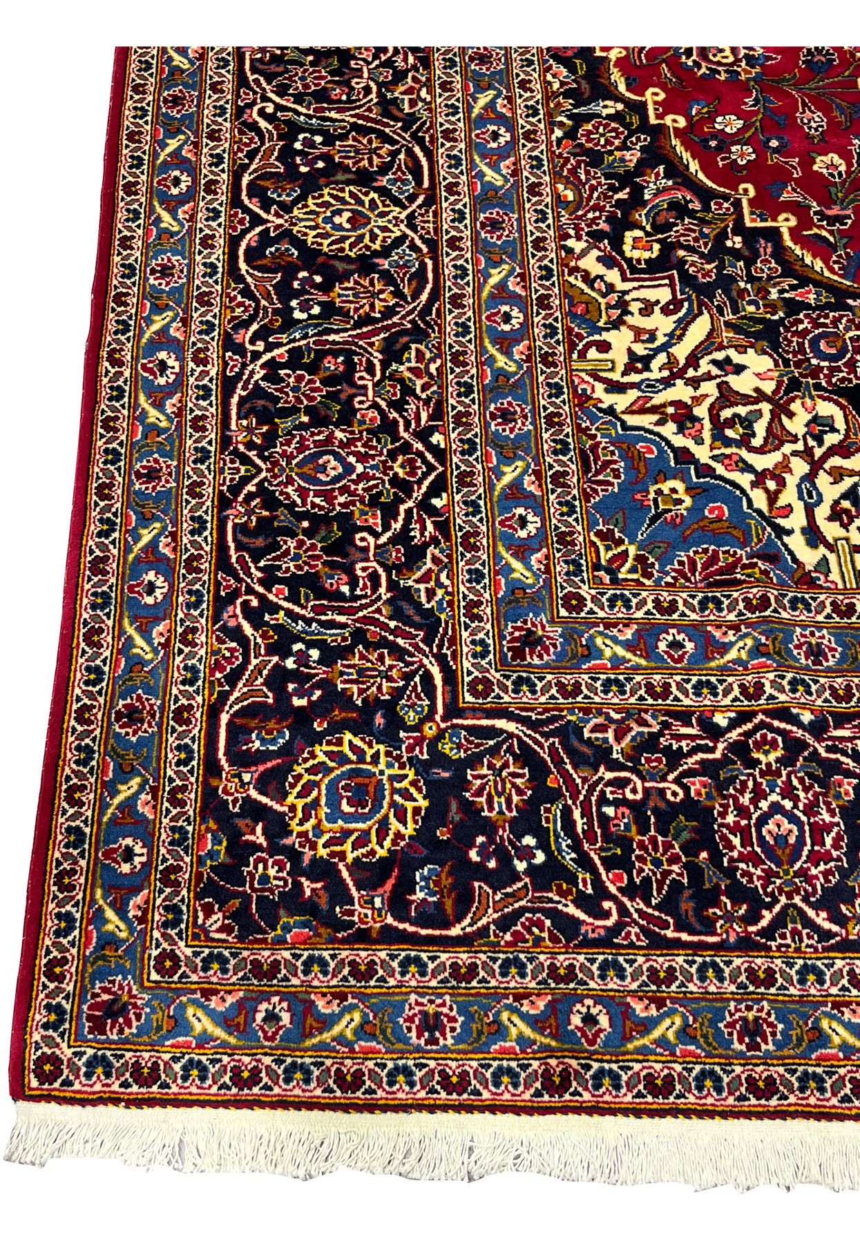 Deep navy main border with ivory vinework and rose palmettes framing this room size rug
