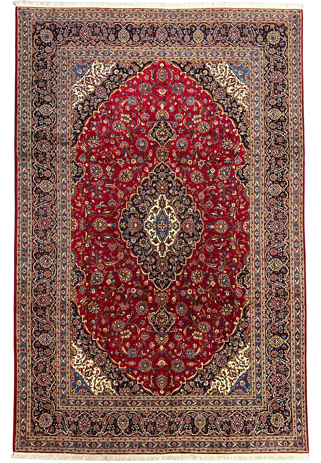 Full view of the classic red Persian Kashan rug seen on the Shark Tank floor, hand knotted wool