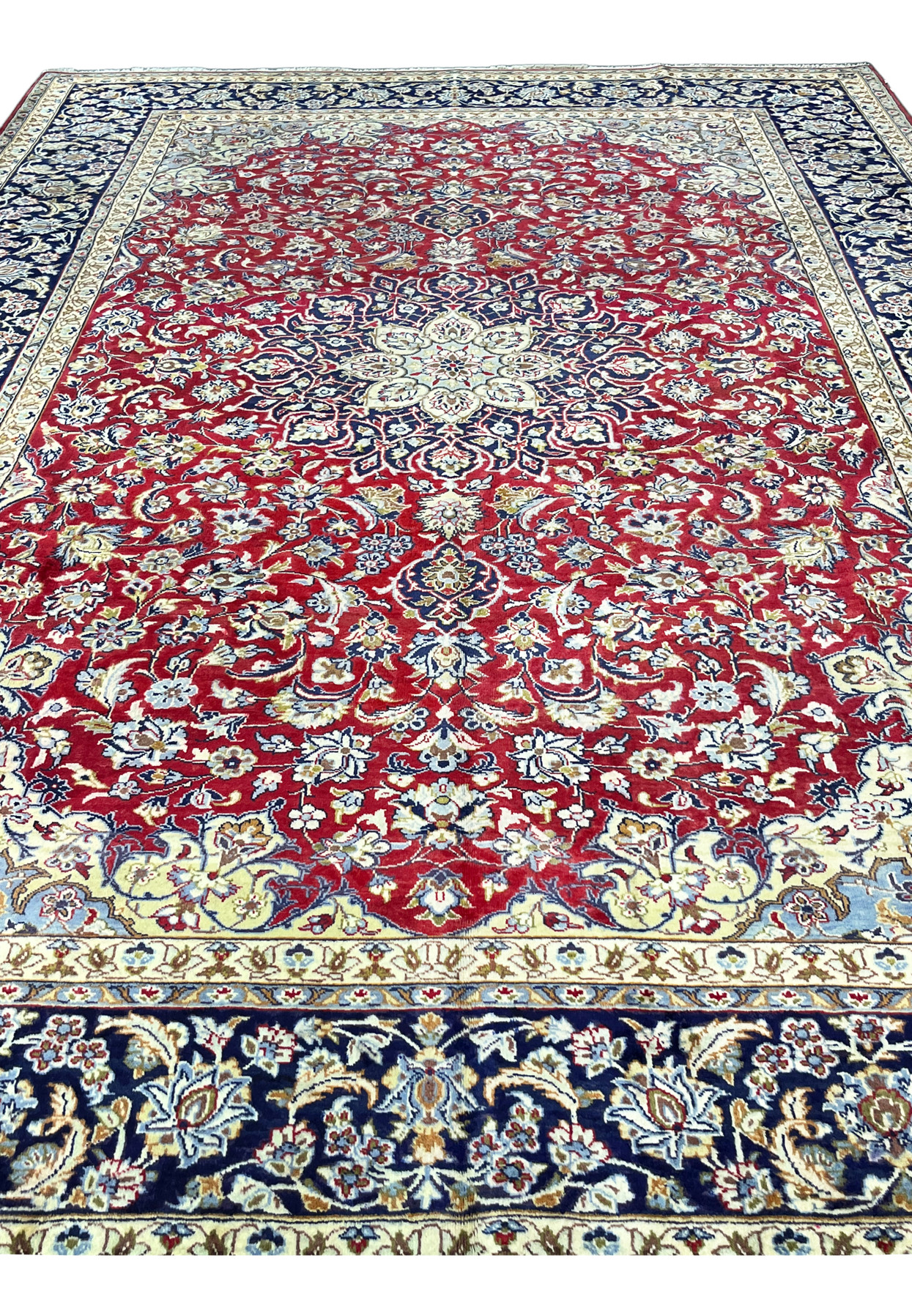 Red field densely worked with lotus palmettes, rosettes and pale blue blossoms