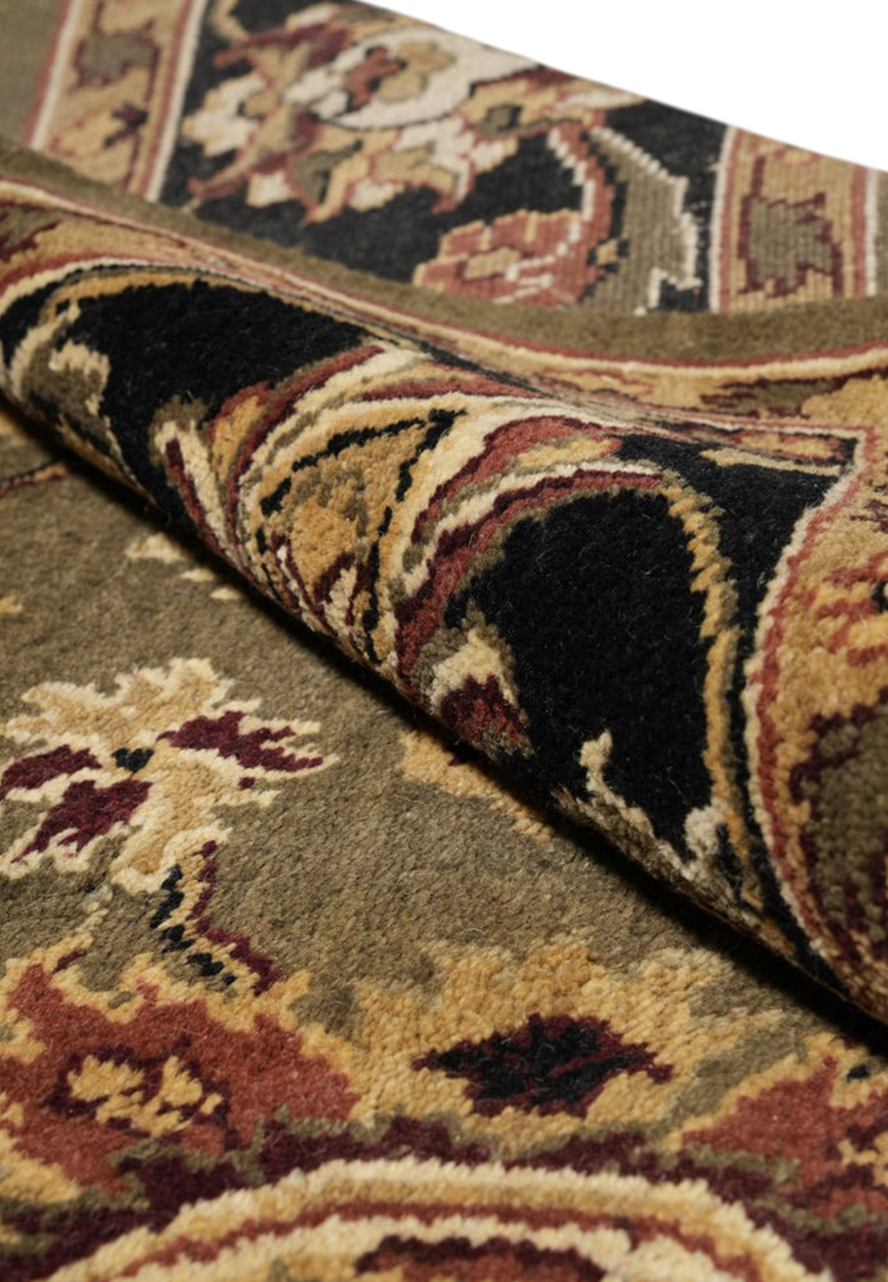Rolled edge of the oversize Oushak rug revealing dense wool pile and hand-knotted foundation