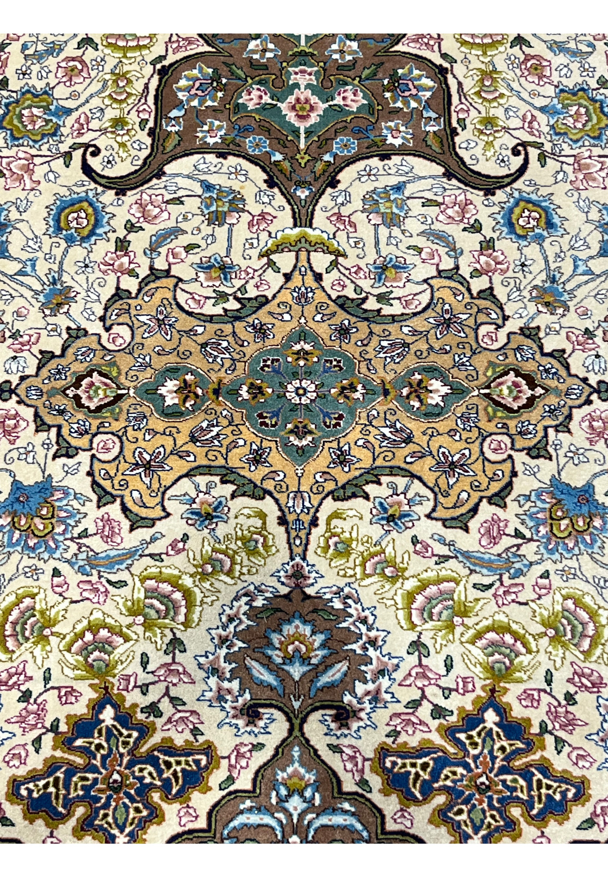 Shah Abbasi palmettes and blossoms in soft pink, blue and gold on the pre-revolution Tabriz field