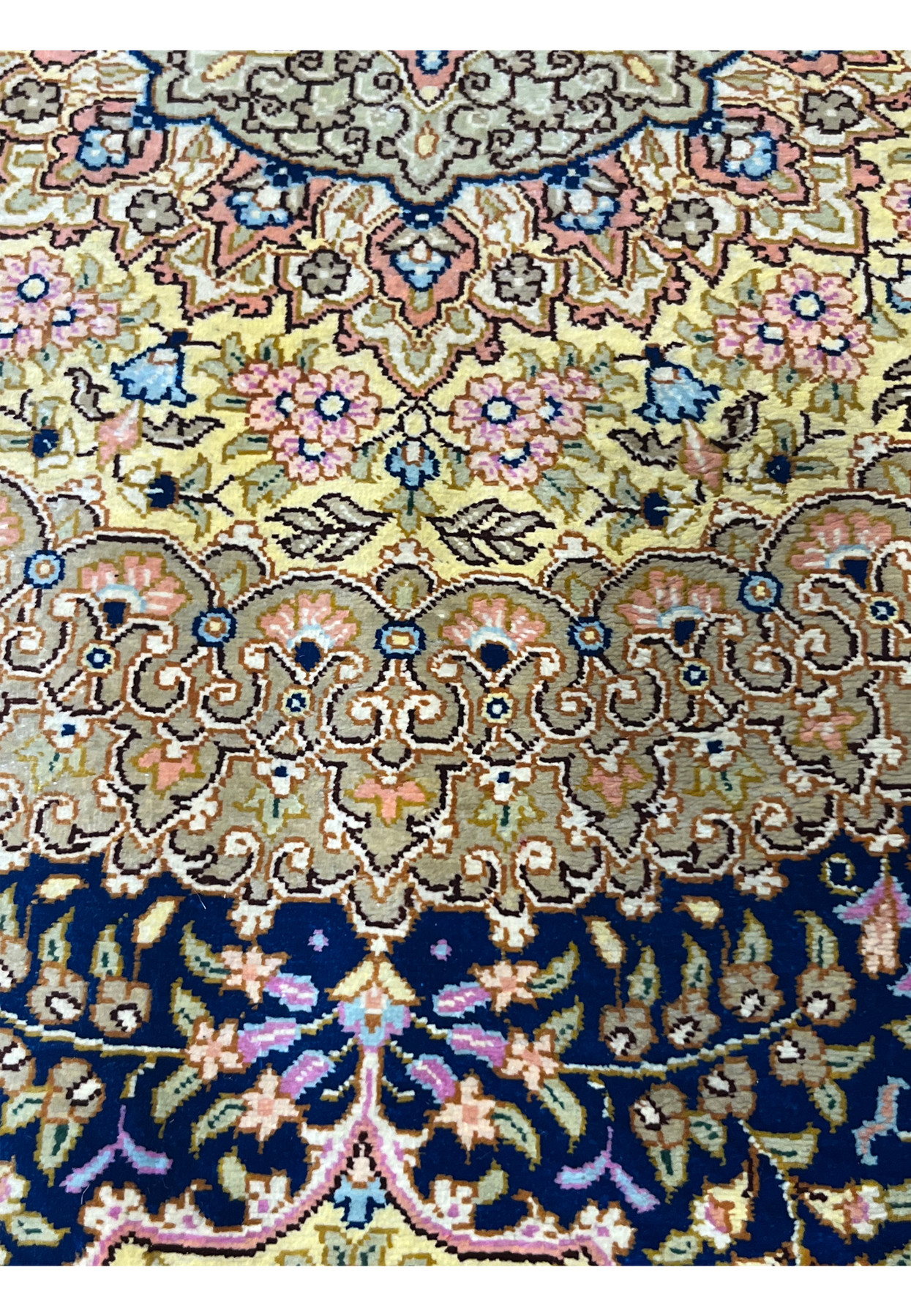 Color close-up showing yellow, salmon, sage green and navy silk yarns side by side