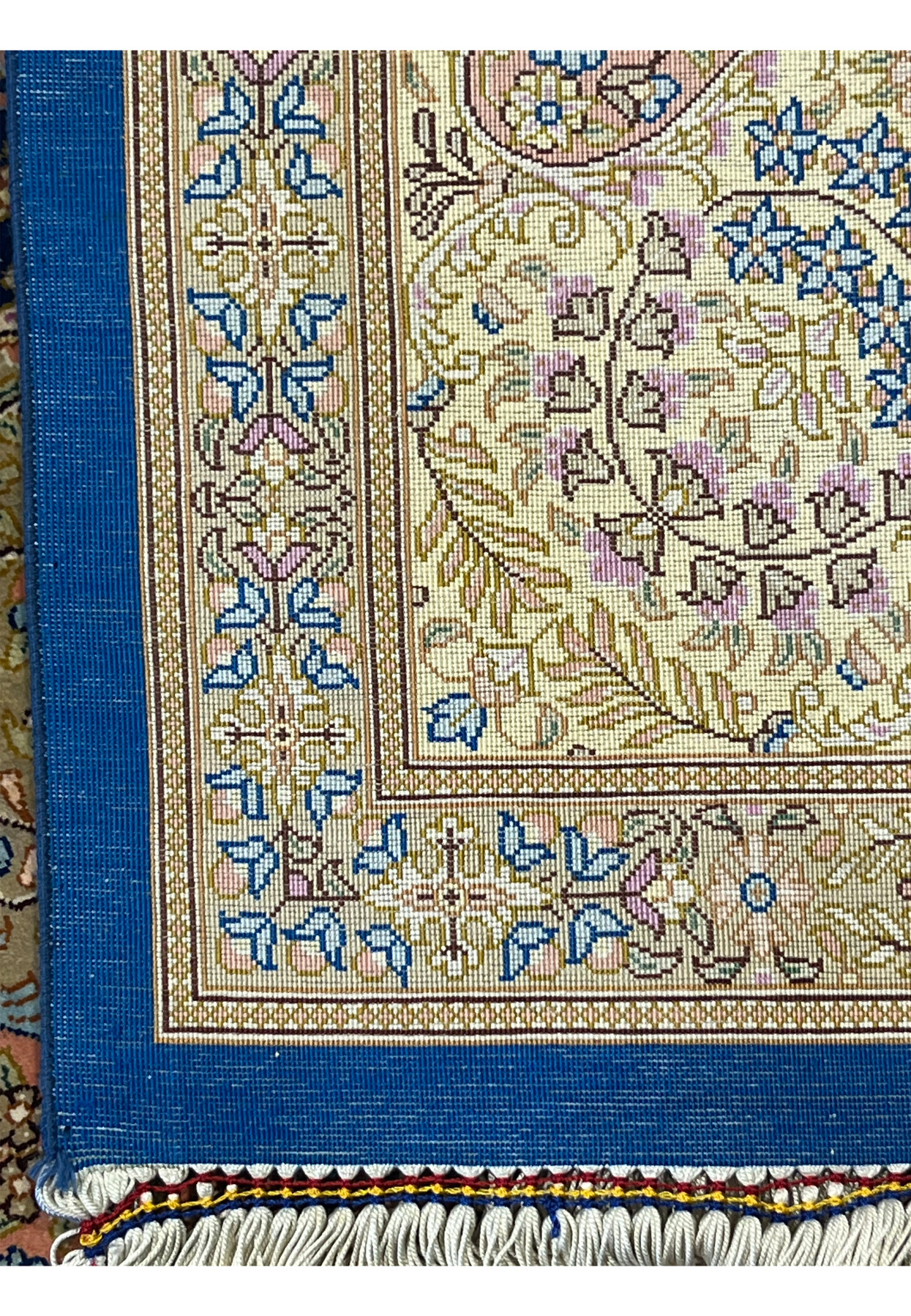 Back of the 5x8 Qum rug showing the crisp knot grid of a pure silk foundation