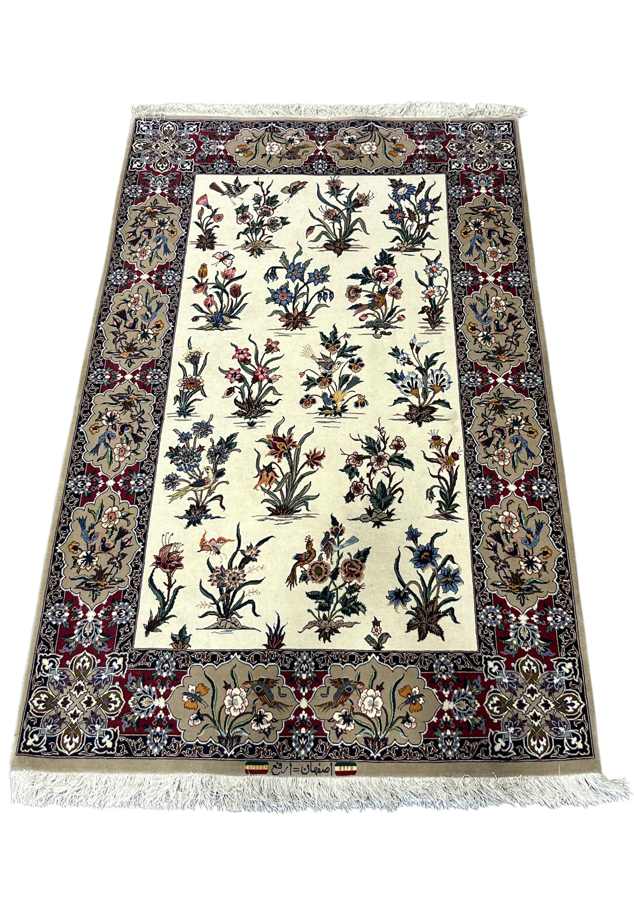 4x6 signed Isfahan rug laid flat showing the red bird cartouche border and ivory field