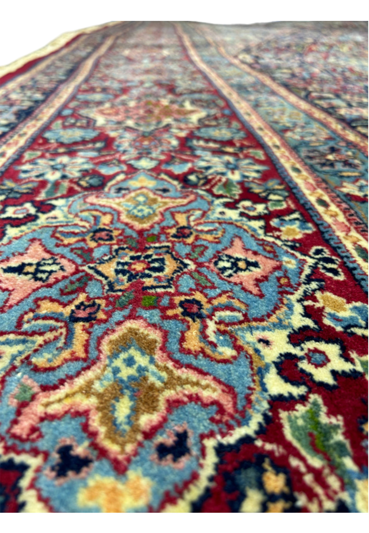 Border close-up with madder red palmettes, blue rosettes and fine ivory outlining