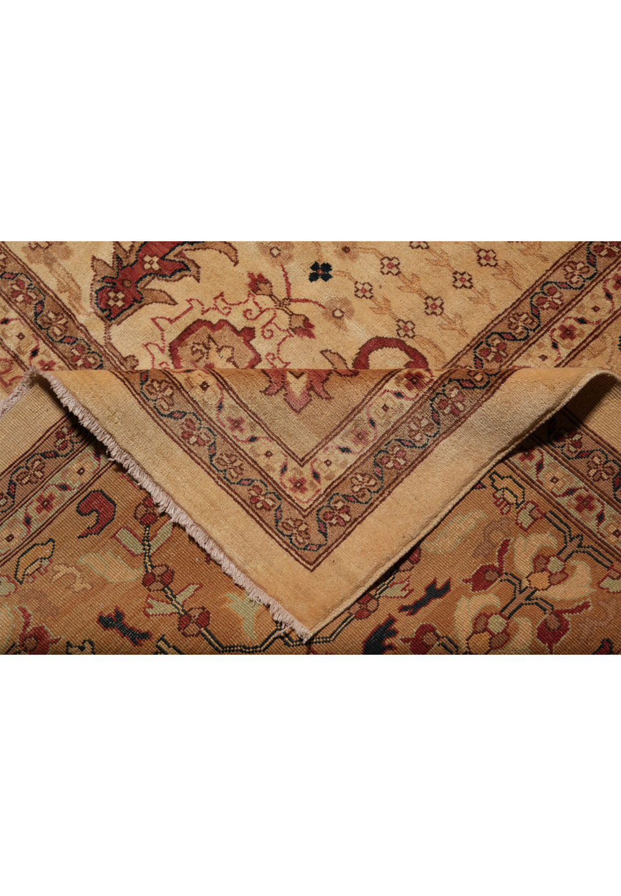 Fold in cream wool-on-cotton Peshawar rug showing ply and edge construction quality