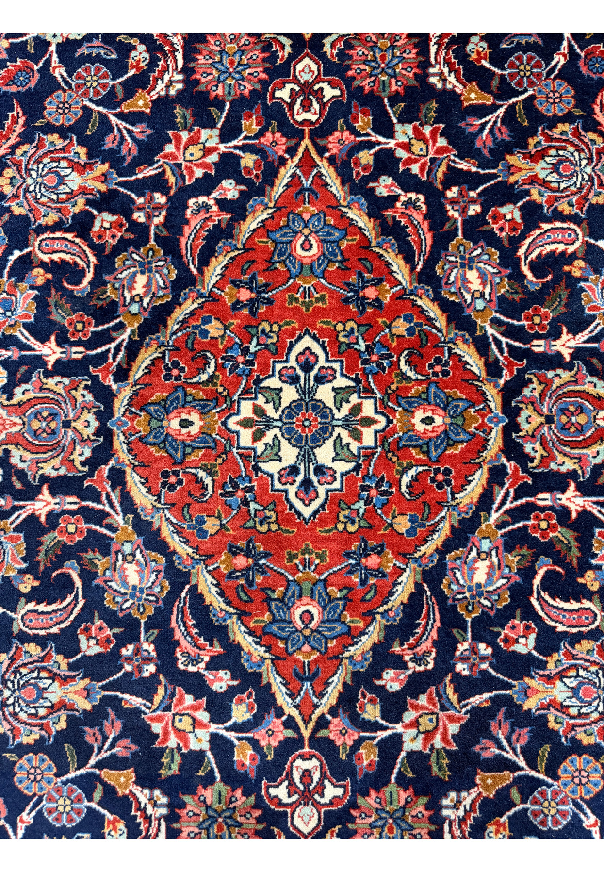 Red lobed medallion with ivory core on navy Kashan field, circa 1920 master weaving