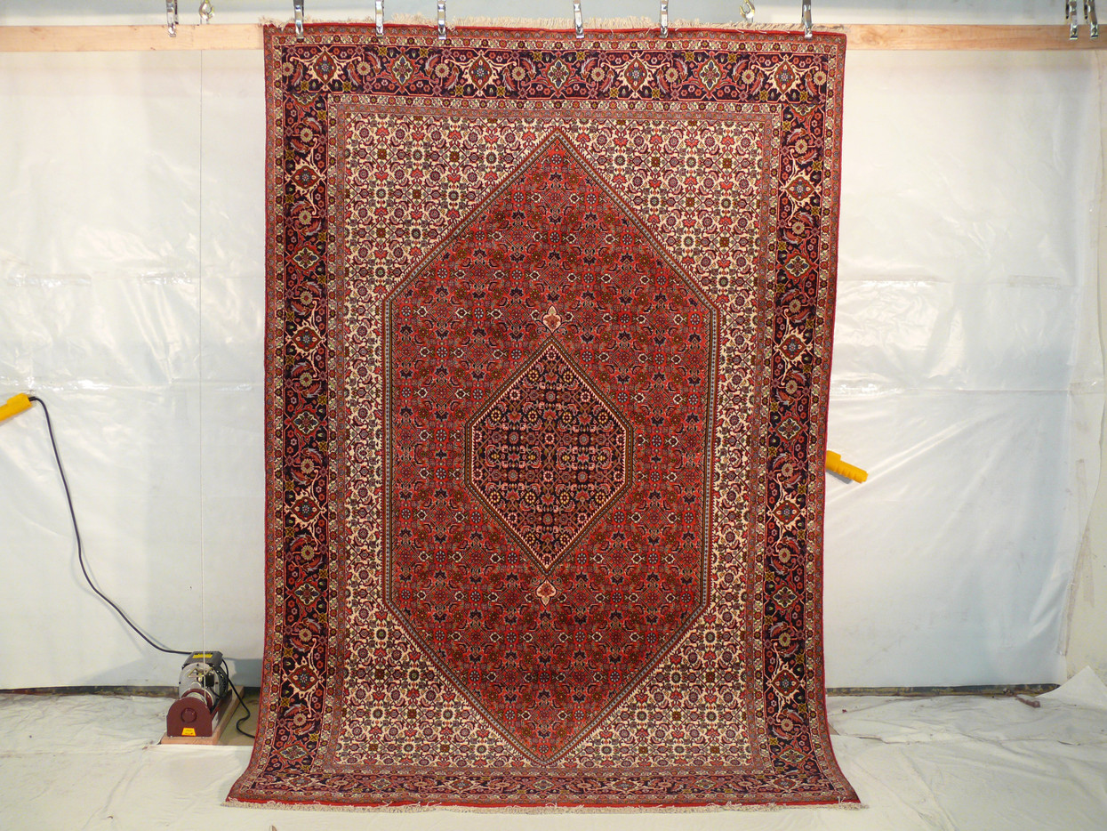 The Persian Bijar Iron Rug laid flat, showing off its complete design and size