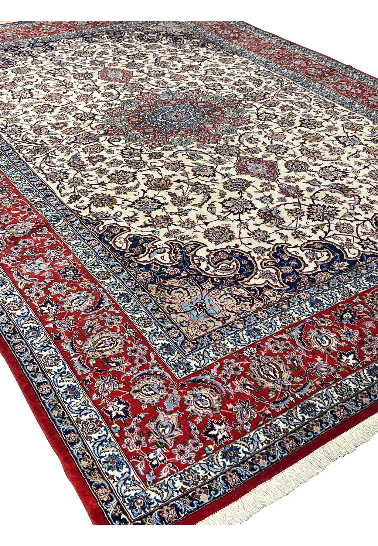 Angled view 8x12 premium Persian Isfahan wool silk rug ivory field crimson red border navy medallion handmade Persia