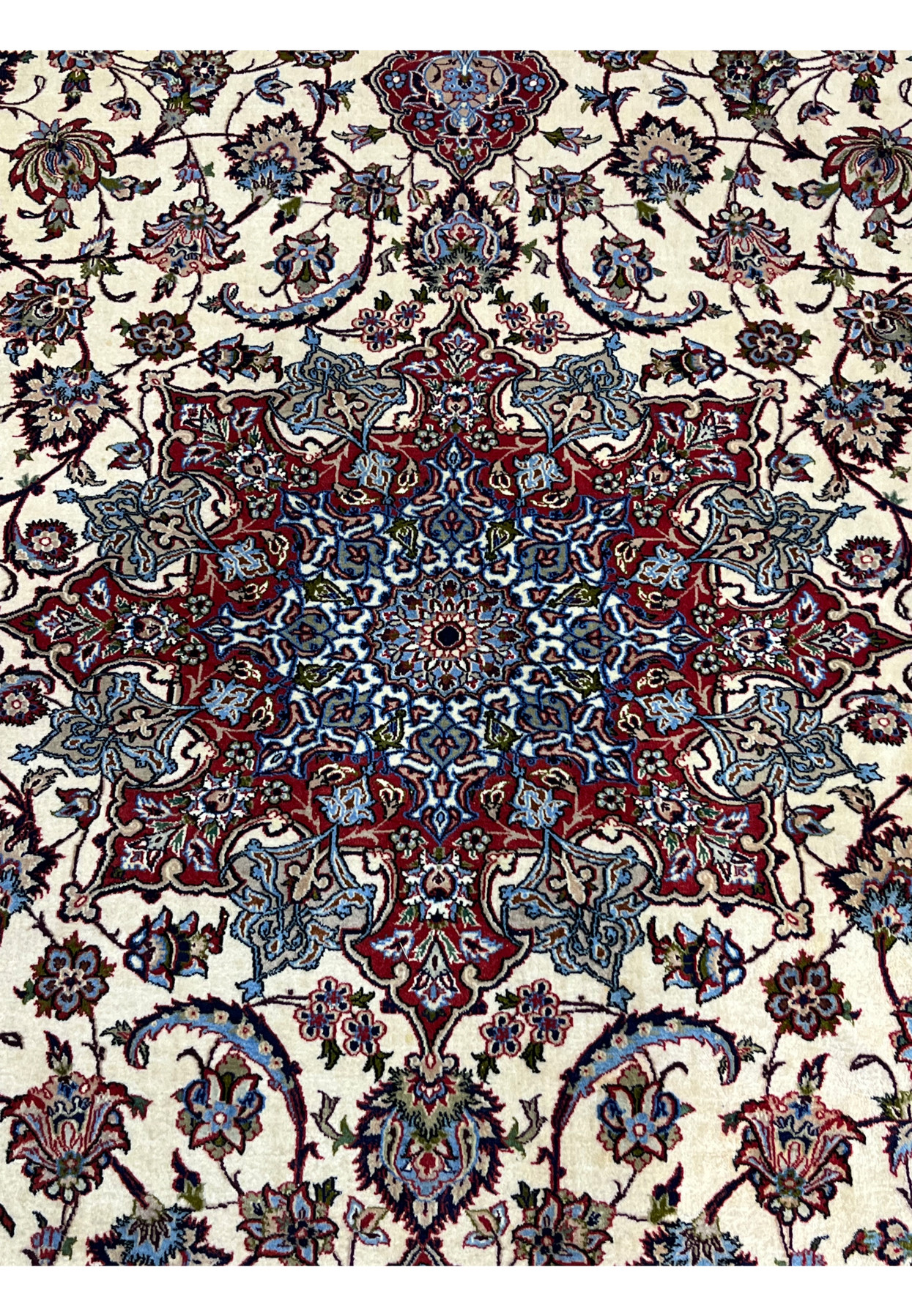 Central medallion closeup 8x12 premium Persian Isfahan wool silk rug navy blue star medallion ivory field crimson surround