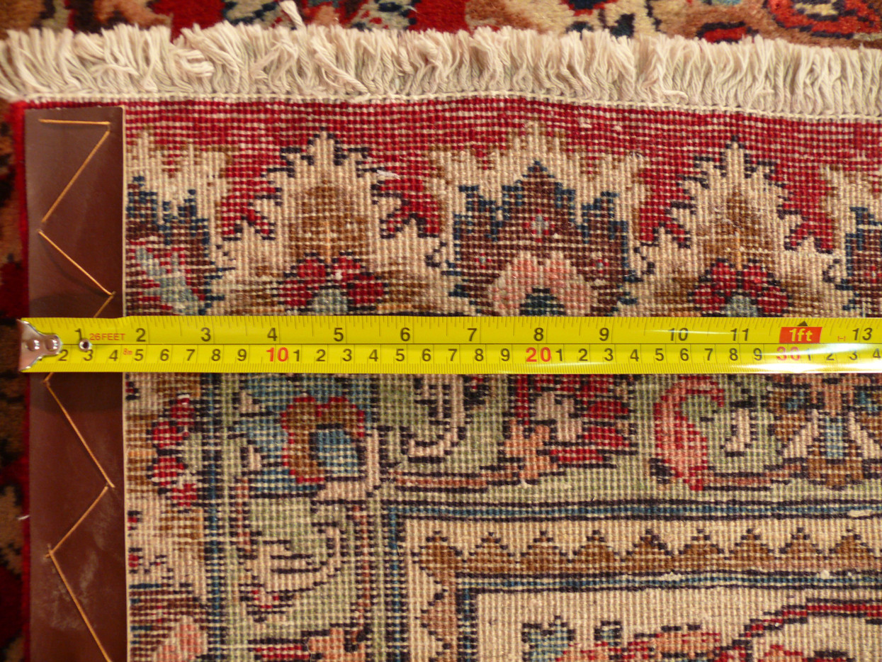 Backside with tape measure across the densely hand-tied knots of the vintage Tabriz