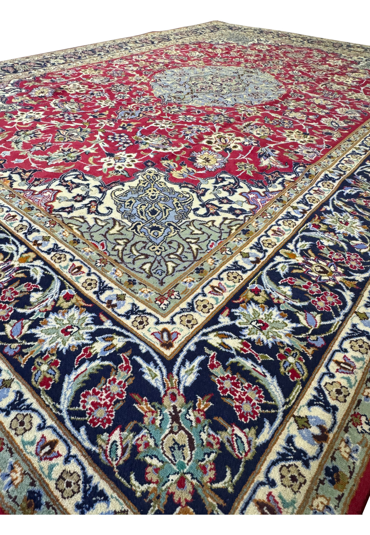 Perspective shot of Persian Isfahan Rug laid out in a room setting.