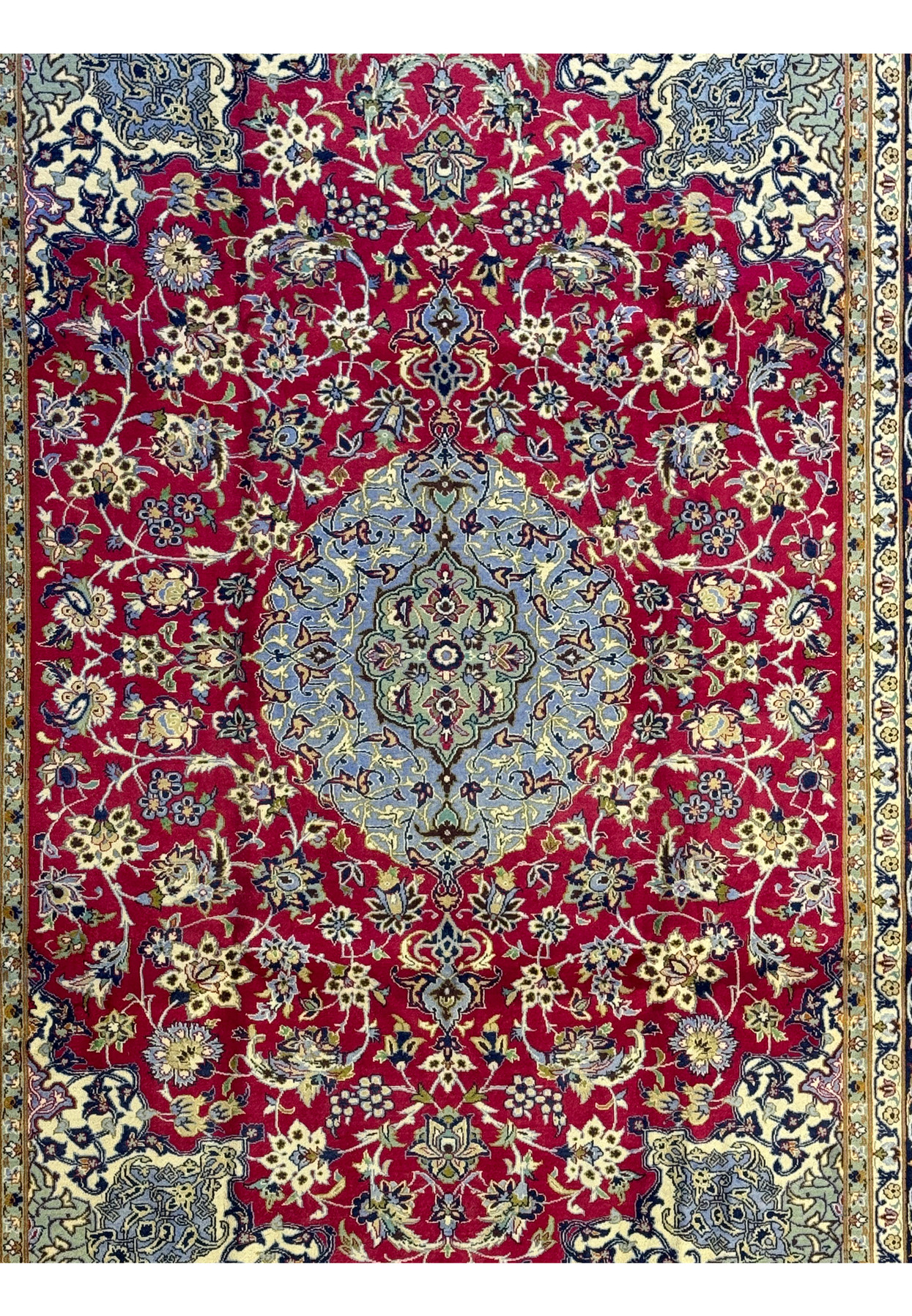 Close-up of central medallion on Persian Isfahan Rug showcasing detailed floral motifs.