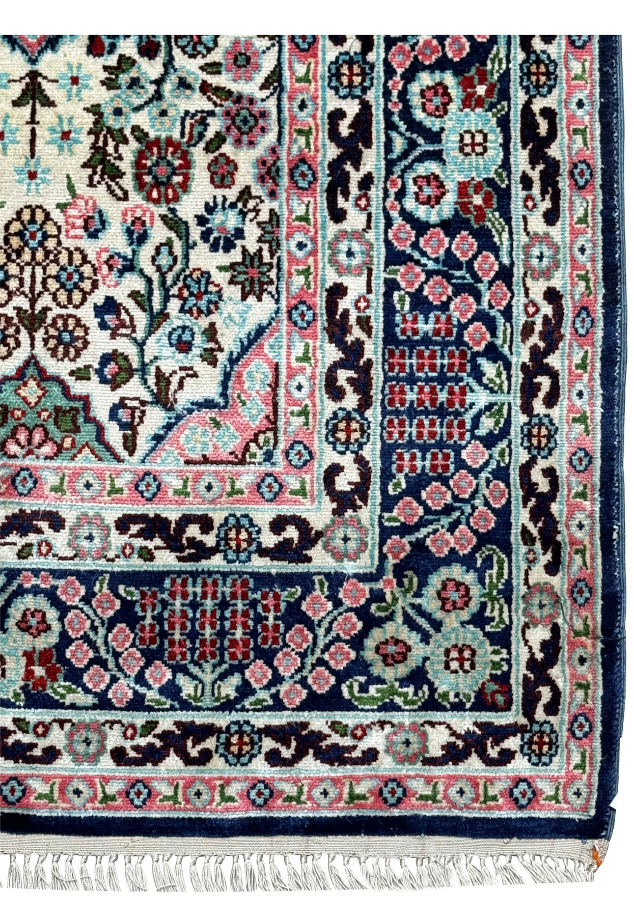 Close-up of the intricate border of a 3 x 5 Persian Qum Silk Rug, featuring floral and geometric patterns in navy and pink.