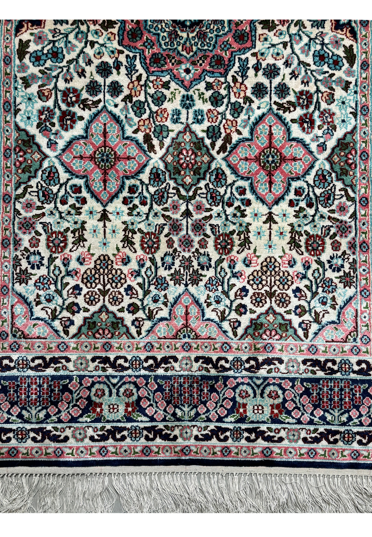 Detailed view of the lower border of a 3 x 5 Persian Qum Silk Rug, showing the intricate floral and geometric motifs.