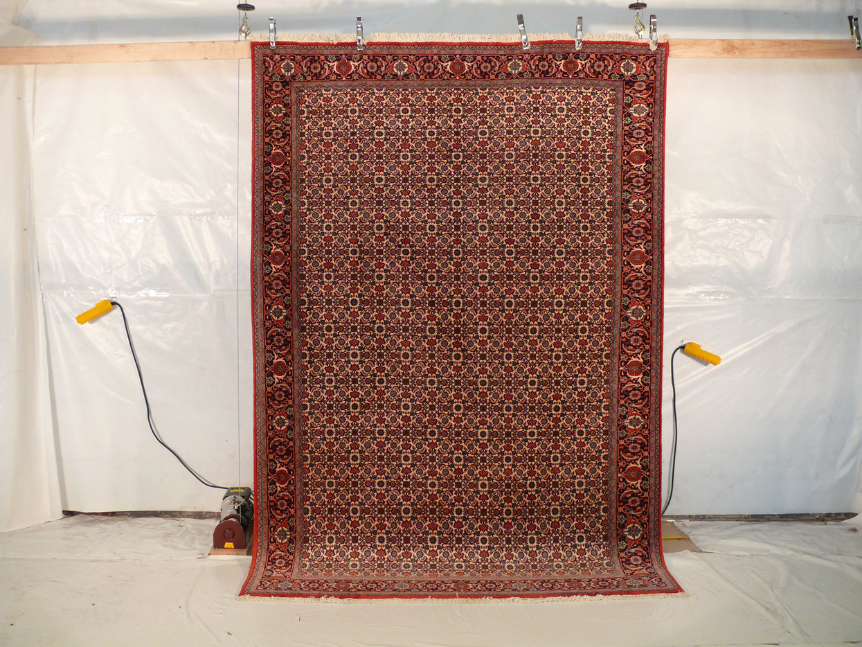 6'5 x 9'5 Bijar Iron Rug of Persia hanging showing the complete rug