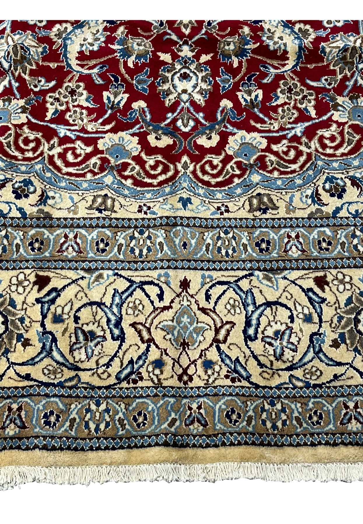 Lower border of Persian Nain rug featuring ivory floral band, navy outlines, and crisp guard border detailing