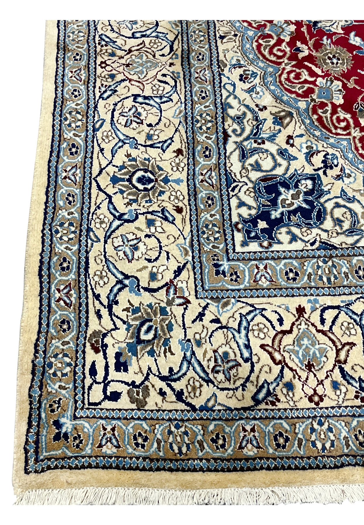 Close view of ivory border on red Persian Nain rug with scrolling floral motifs and fine symmetrical drawing