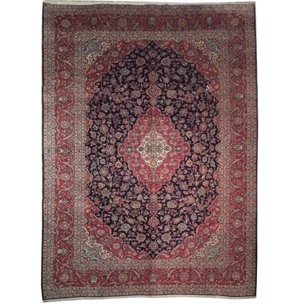 Authentic Handmade Persian Kashan rug with a detailed central medallion in red and blue floral motifs on a luxurious wool fabric, size 10x13.5 feet.