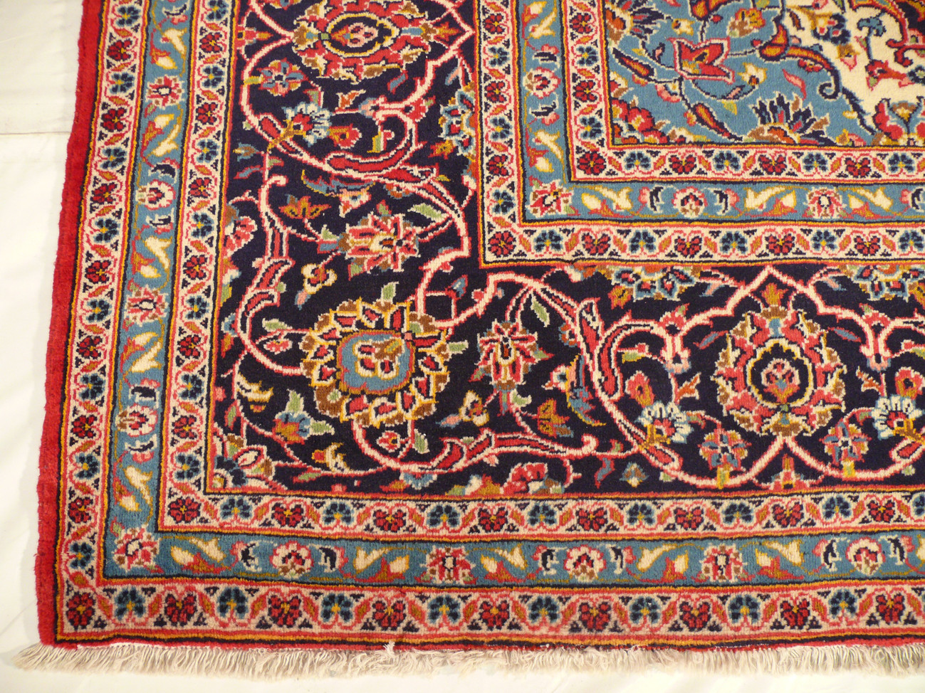 Discover the beauty of the border of a  Persian artistry with our 10 x 13 wool on cotton foundation Persian Kashan rug, featuring unique patterns and featured on Shark Tank