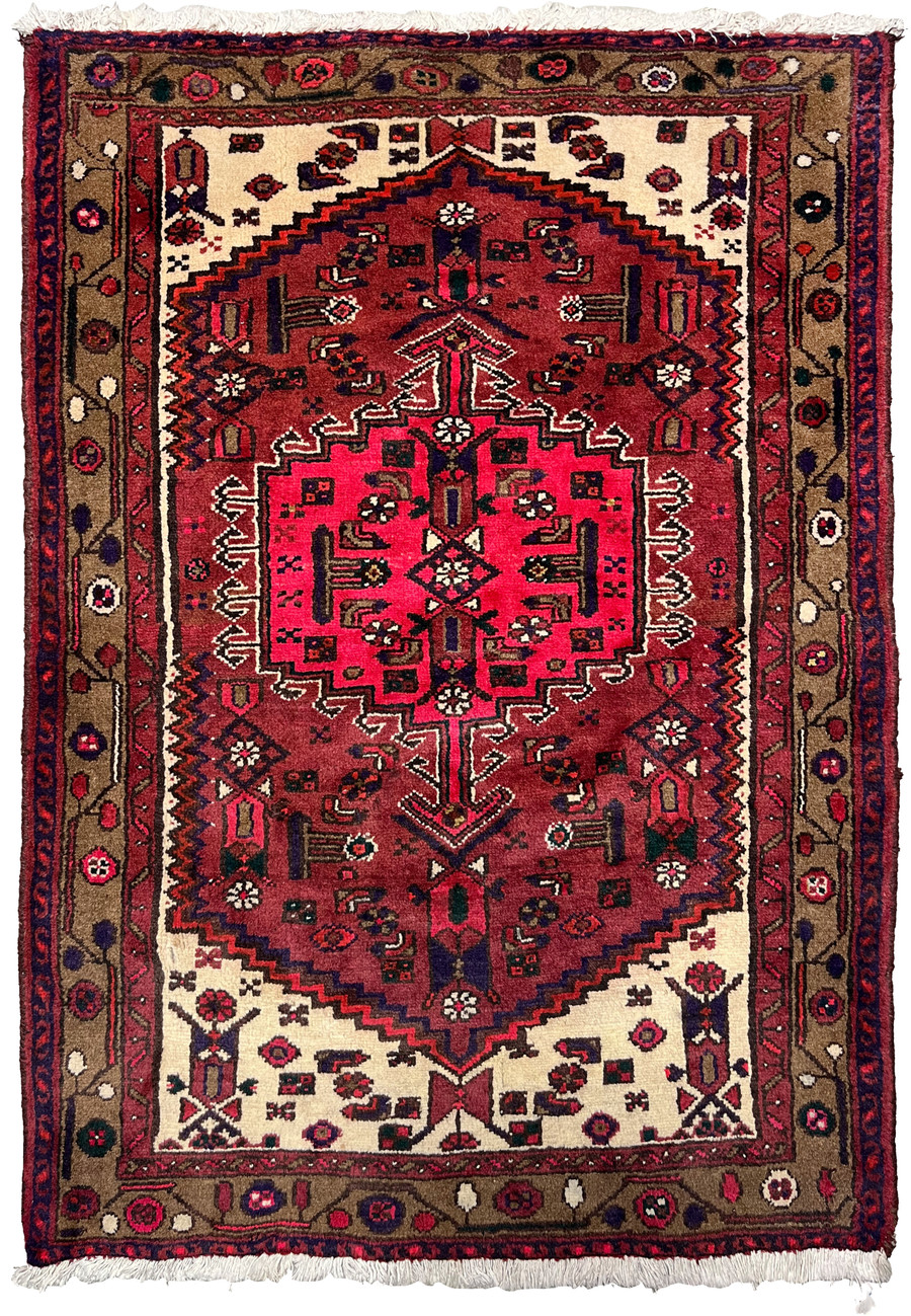 Full view of a 3'3 x 4'4 antique Persian Hamedan tribal rug with bold red geometric medallion, ivory spandrels, and classic village border motifs