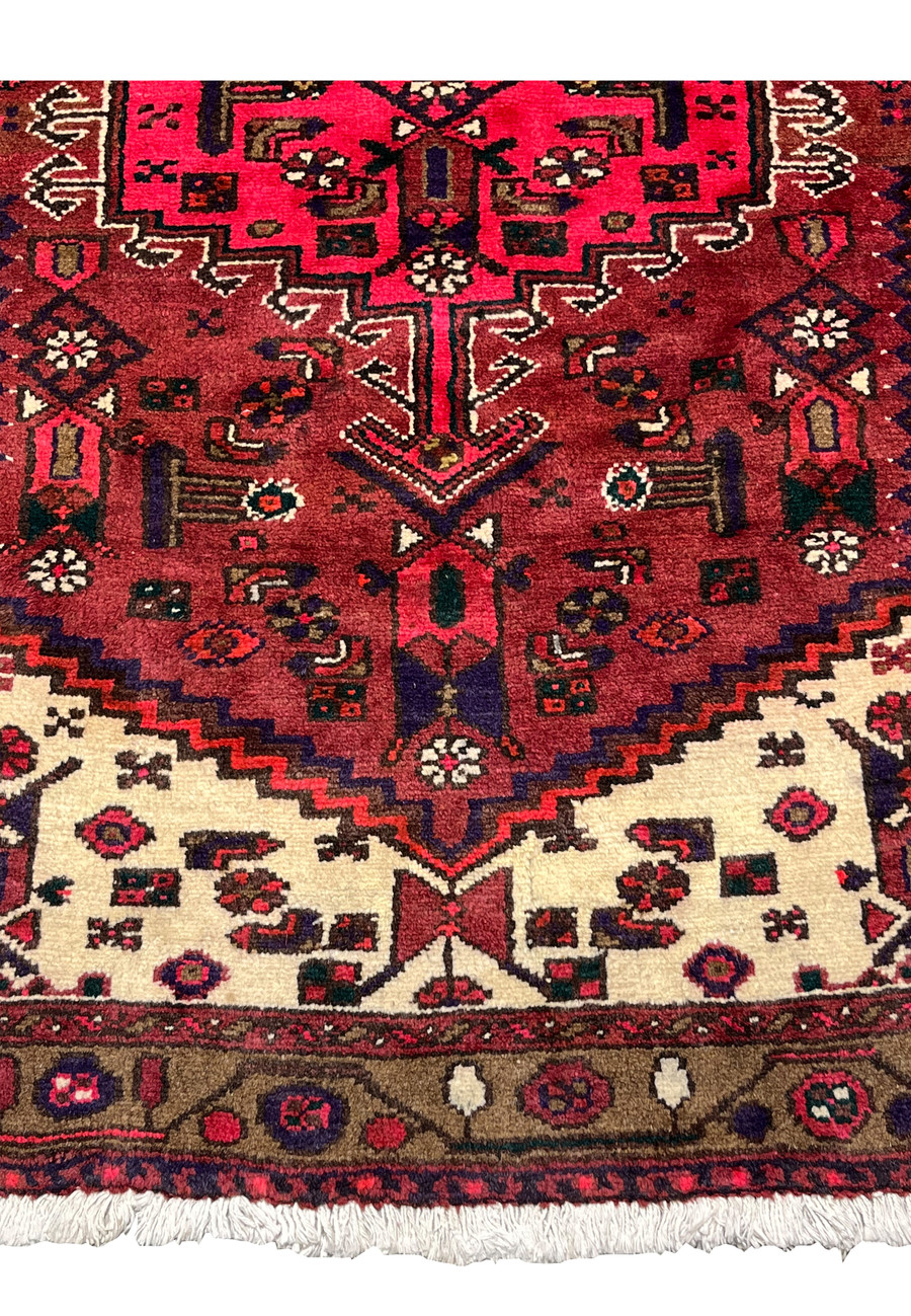 Lower border and fringe detail of a Persian Hamedan tribal rug showing intact edges, hand-knotted structure, and balanced geometric ornamentation