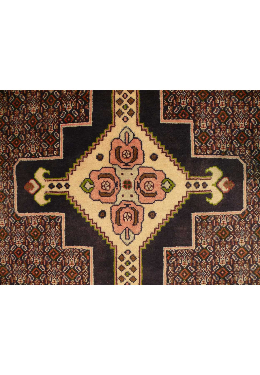 A Persian Senneh runner with a diamond lattice pattern in neutral tones of beige and brown, placed in a modern entryway.