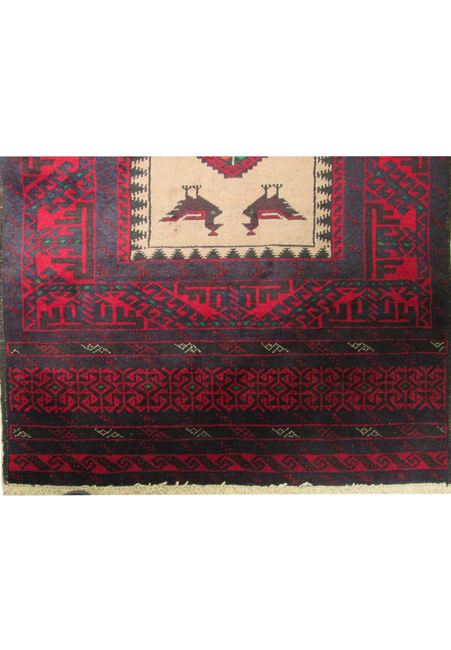 Detailed shot of the border and corner design of the Persian Baluch rug