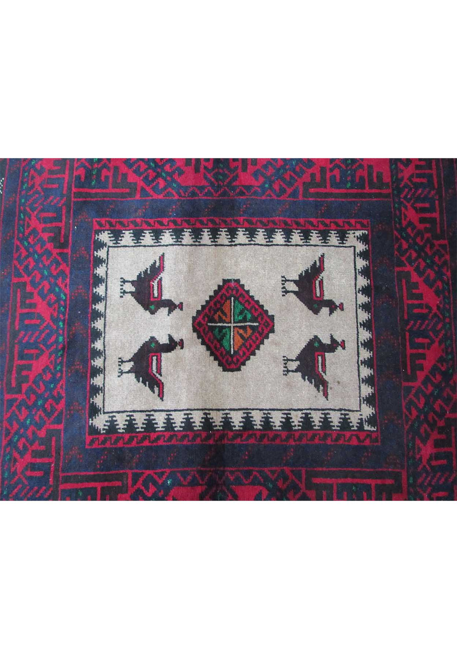 Elegant traditional motifs on the 3 x 5'2 Persian Baluch rug in rich colors