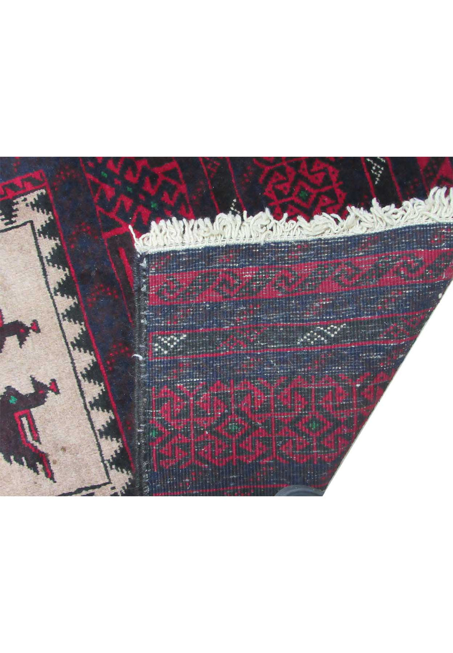 Hand-knotted wool texture of the 3 x 5'2 Persian Baluch rug