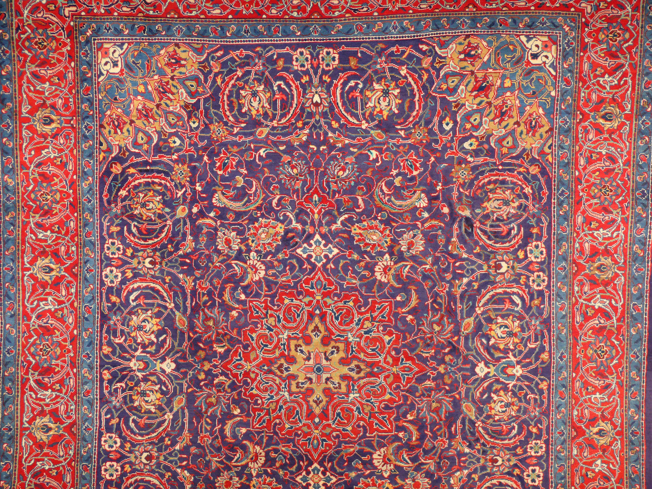 Luxurious wool Persian rug featuring floral patterns and a large medallion design