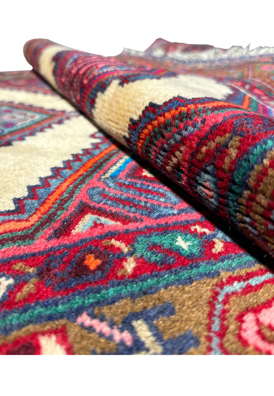 Side view of a Persian Hamedan runner rug highlighting the weave and edge finishing