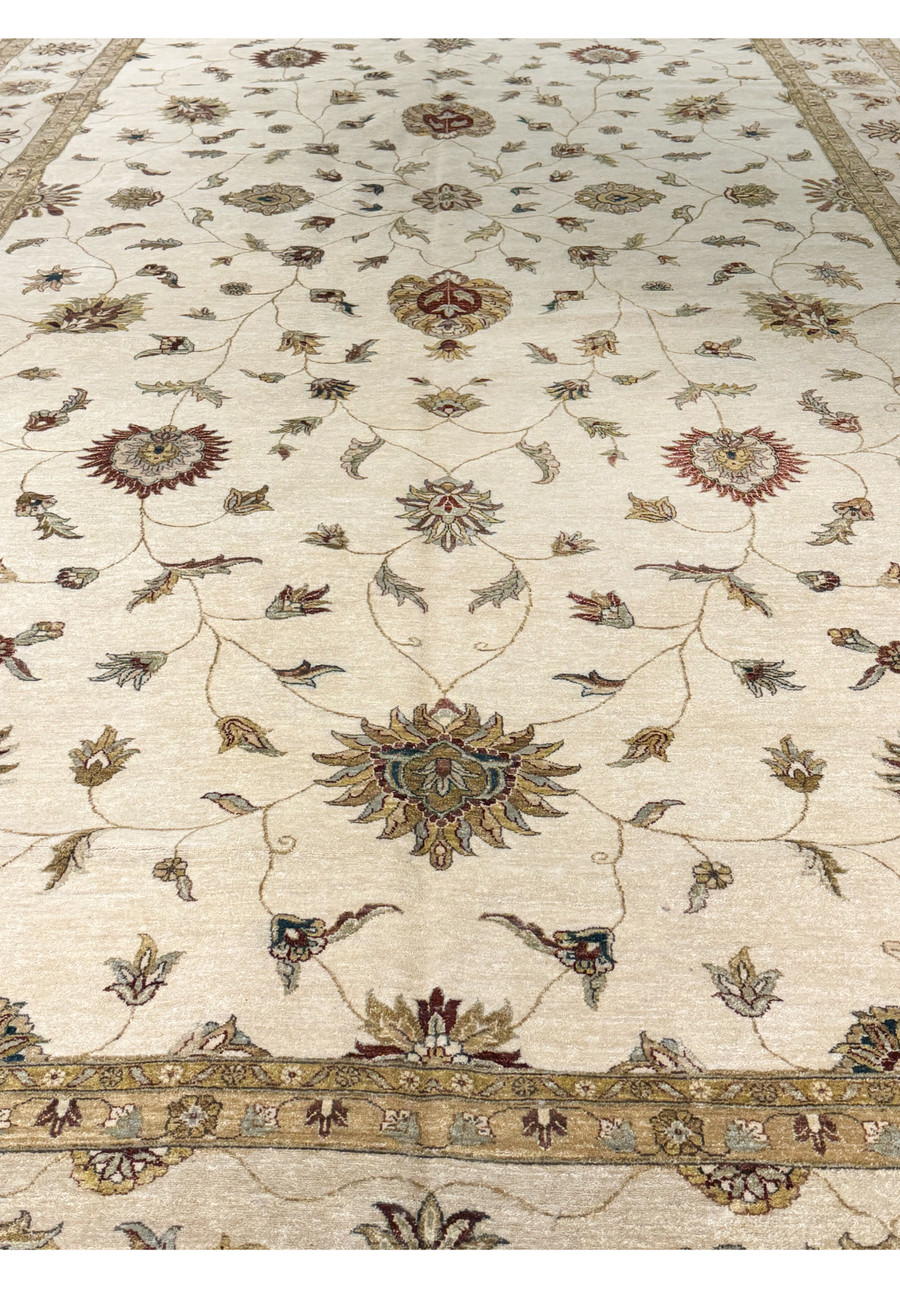 Close-up of the floral and vine designs illustrating the rug's delicate artistry.
