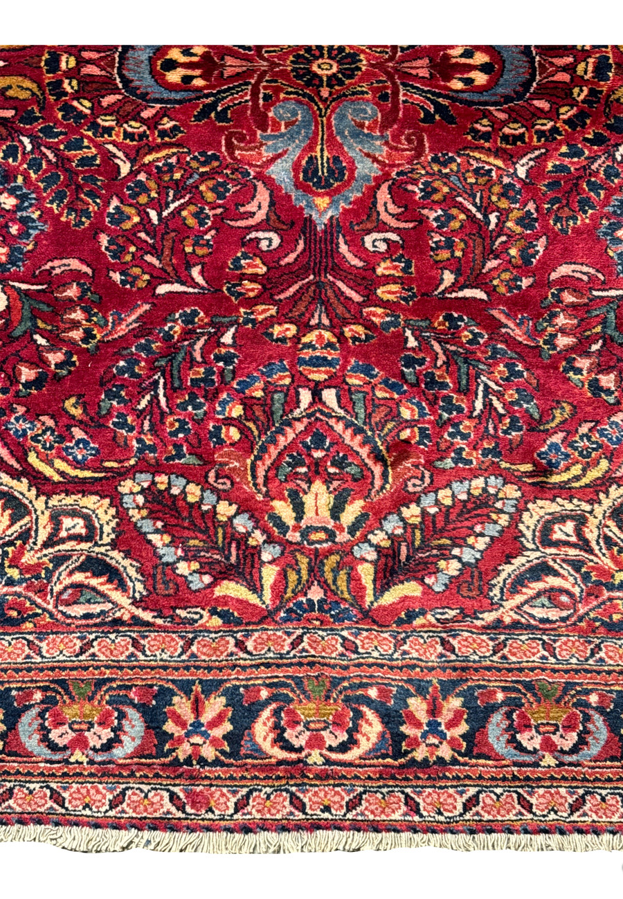 Close-up of the 4x7 Antique Persian Lilihan Rug’s border pattern with deep indigo and coral accents.
