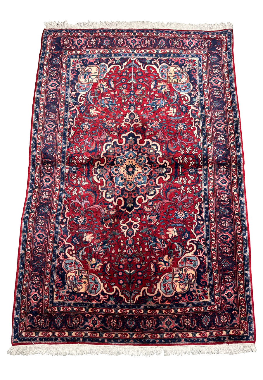 Close-up of the Persian Sarough rug highlighting the intricate details and color variations in the central design area.