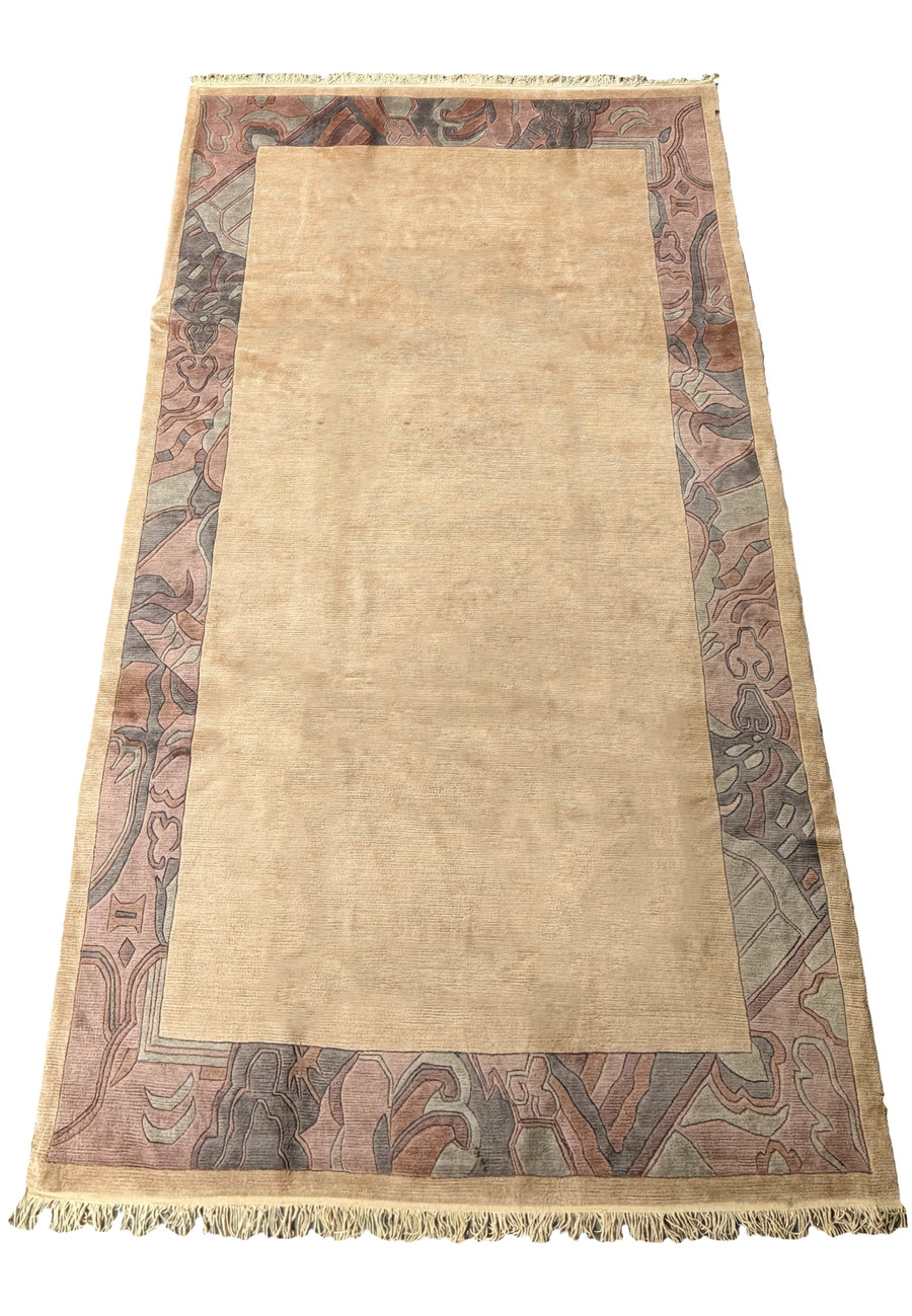 Full-length view of a 6'6 x 12'8 Modern Royal Tibetan beige rug showcasing the border and fringe details