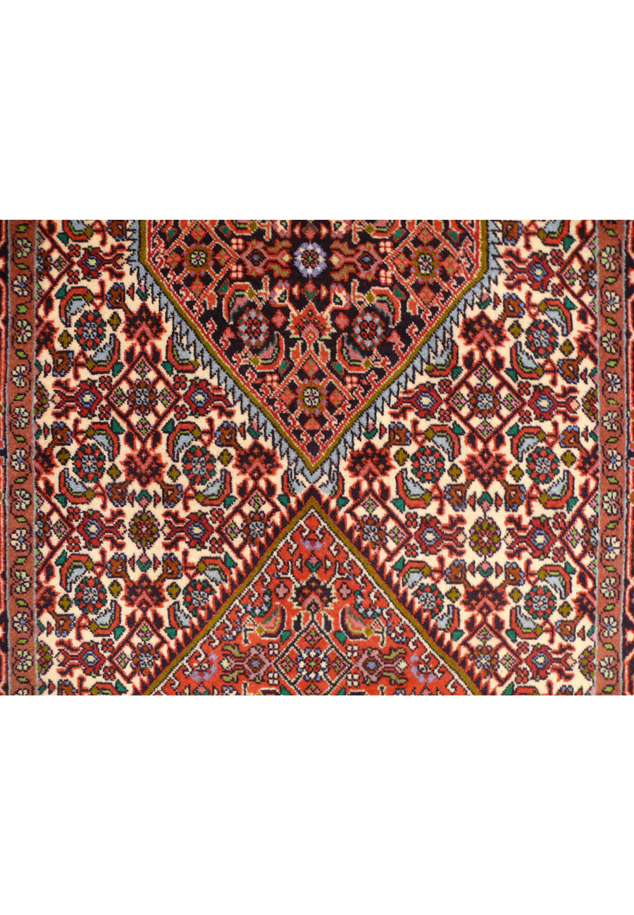 Close-up of the Persian Bijar Runner Rug's edge, displaying the fine fringe and tight weave along the borde