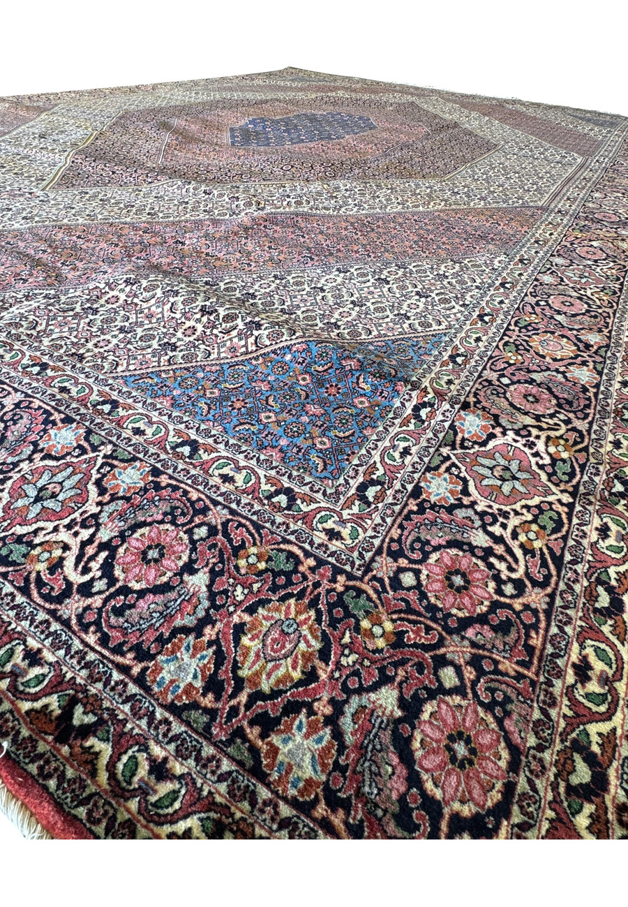 Detailed view of the edge of a Persian Bijar rug, showcasing the elaborate border patterns and delicate fringe.