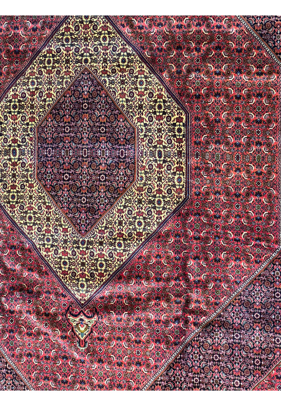 Detailed image of the Bijar Rug’s corner, showing the intersection of the border and the field's dense pattern