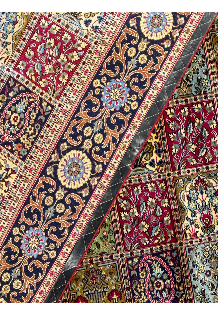 Backside detail of a Persian Qum Kork rug showcasing the tight knot structure and pattern clarity, indicative of high-quality craftsmanship